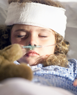 Little girl in hospital bed after grave injury